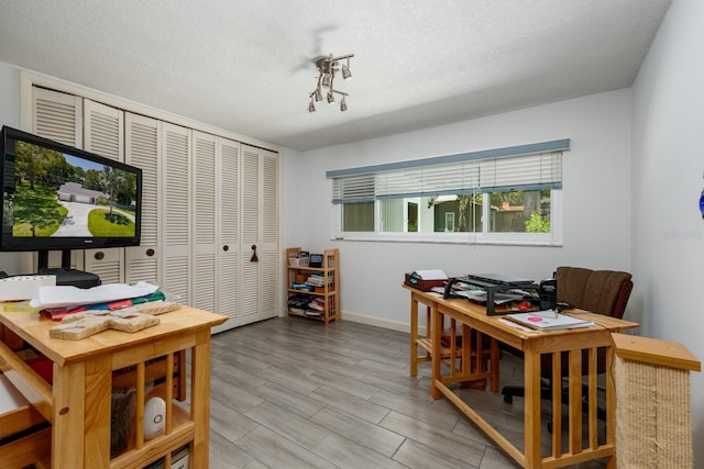 office area with a textured ceiling