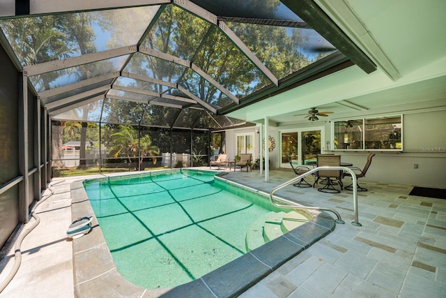 view of pool featuring a lanai, a patio area, and ceiling fan