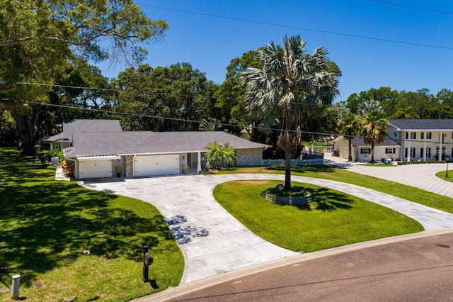 single story home featuring a front lawn