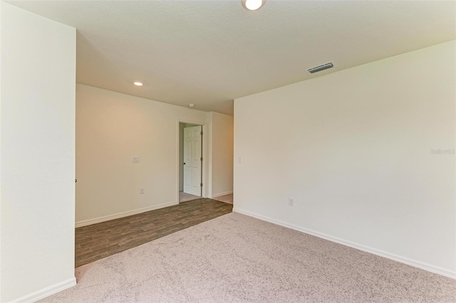 spare room with hardwood / wood-style floors