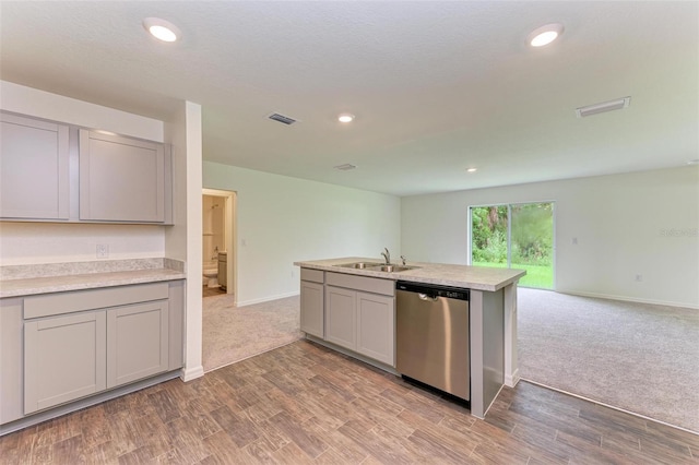 kitchen with stainless steel dishwasher, gray cabinets, and sink