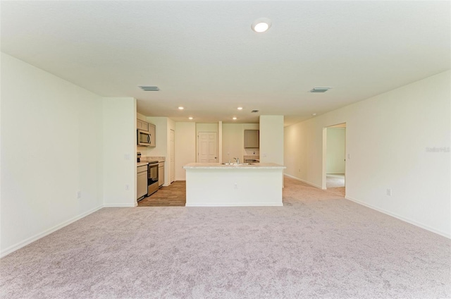 unfurnished living room with light carpet