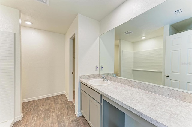 bathroom featuring hardwood / wood-style floors and vanity