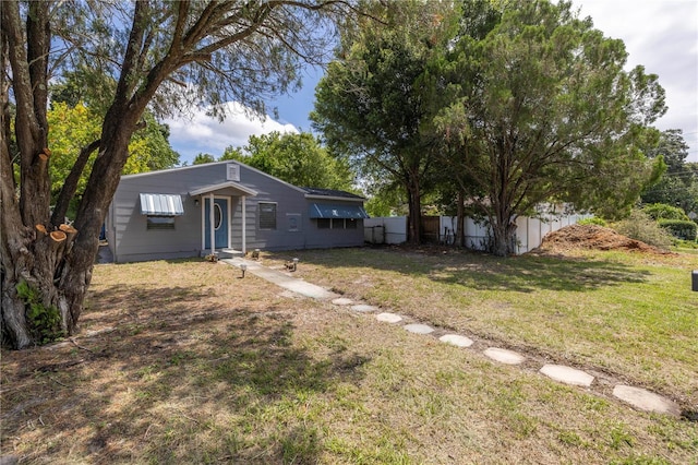 view of front of property with a front lawn