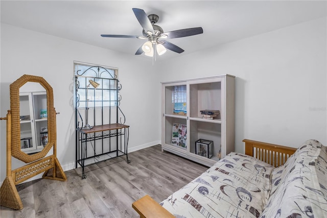 sitting room featuring hardwood / wood-style floors and ceiling fan