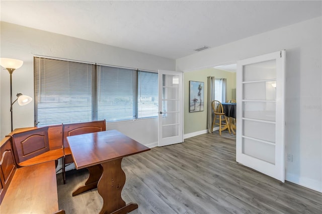 dining space featuring hardwood / wood-style flooring