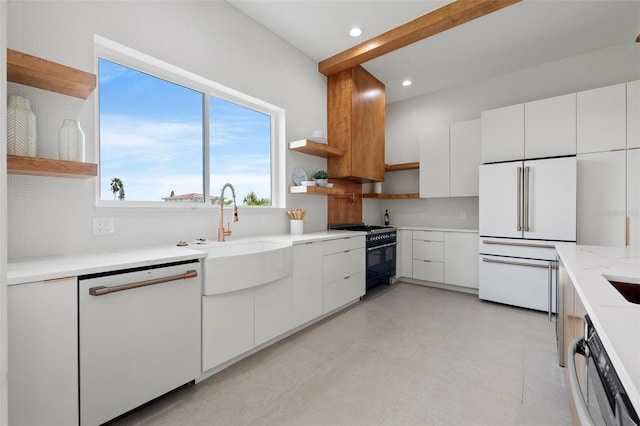 kitchen featuring white cabinets, white appliances, backsplash, and sink