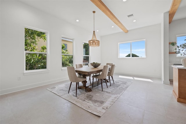 dining area with beamed ceiling and an inviting chandelier