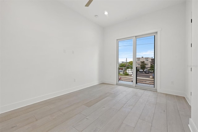 spare room with ceiling fan and light hardwood / wood-style floors