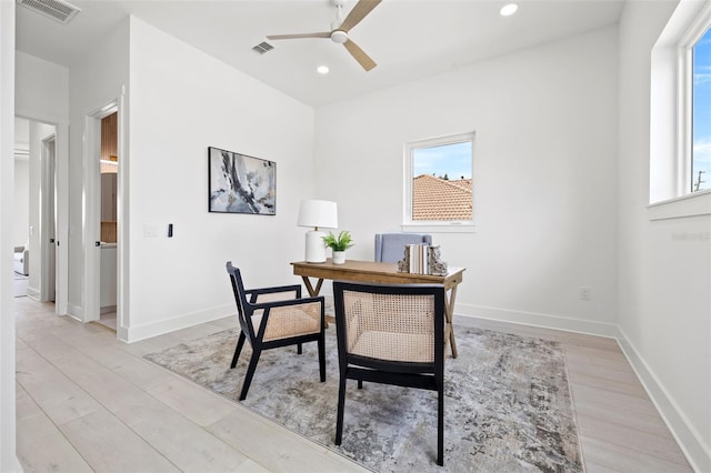 office with ceiling fan and light wood-type flooring