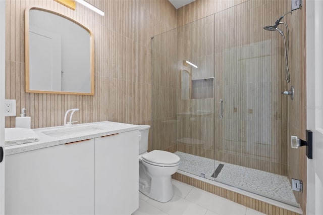 bathroom with tile patterned floors, vanity, and an enclosed shower