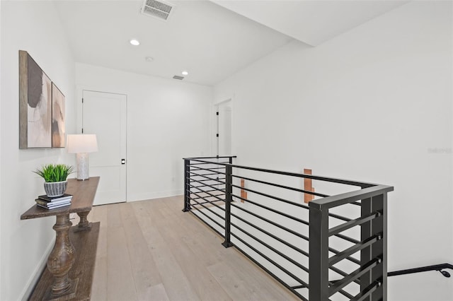 hallway with light hardwood / wood-style flooring