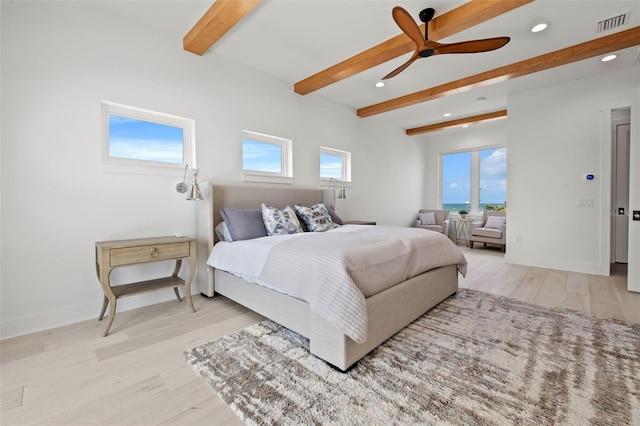 bedroom featuring beam ceiling, ceiling fan, and light wood-type flooring