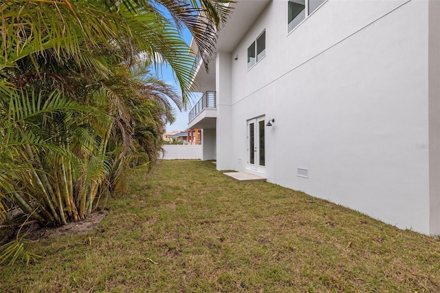 view of yard with french doors