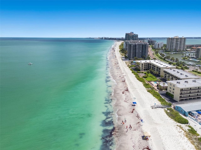 drone / aerial view with a water view and a beach view