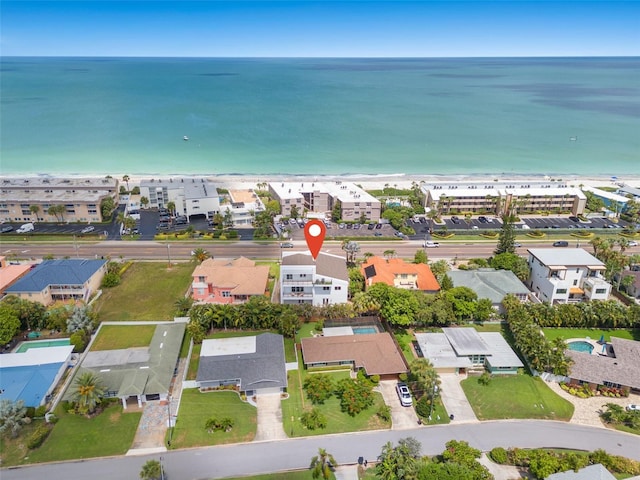 drone / aerial view with a water view and a view of the beach