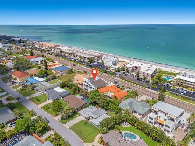 drone / aerial view featuring a view of the beach and a water view