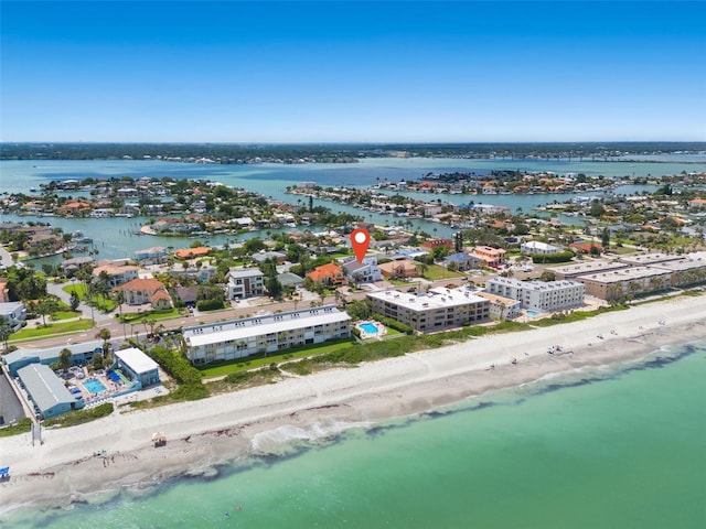 bird's eye view with a water view and a beach view