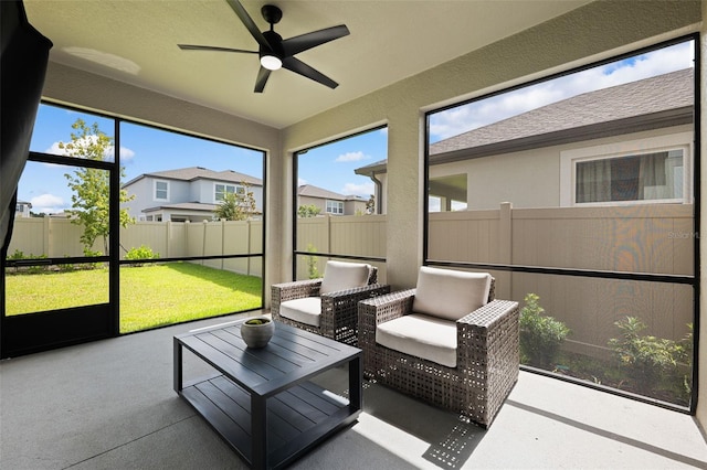 sunroom / solarium with ceiling fan