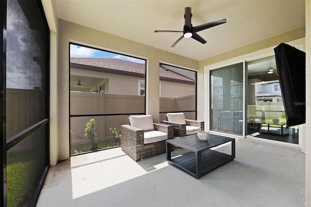 sunroom with ceiling fan