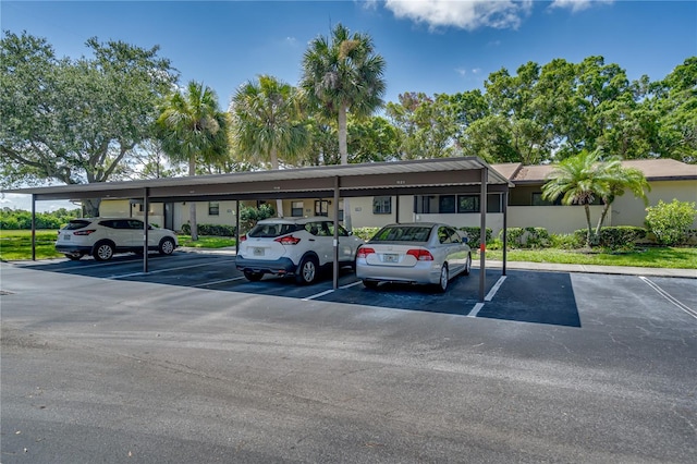 view of parking / parking lot featuring a carport