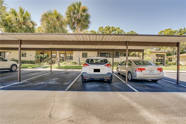 view of vehicle parking with a carport