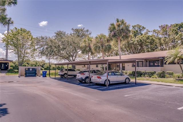 view of parking / parking lot featuring a carport