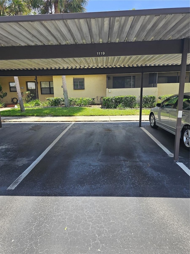 view of parking / parking lot with a carport