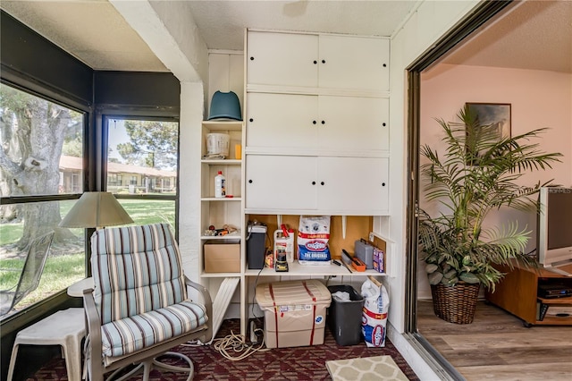 living area with hardwood / wood-style flooring