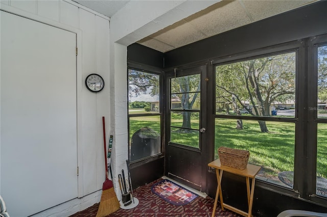 doorway featuring a paneled ceiling