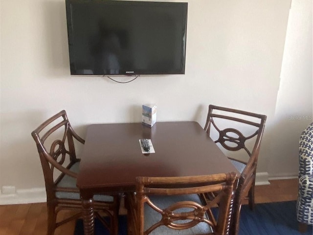 dining area with dark wood-type flooring