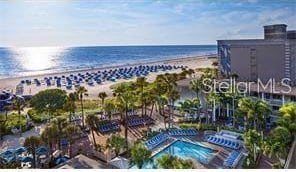 bird's eye view with a view of the beach and a water view