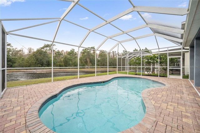 view of pool featuring a patio area and glass enclosure