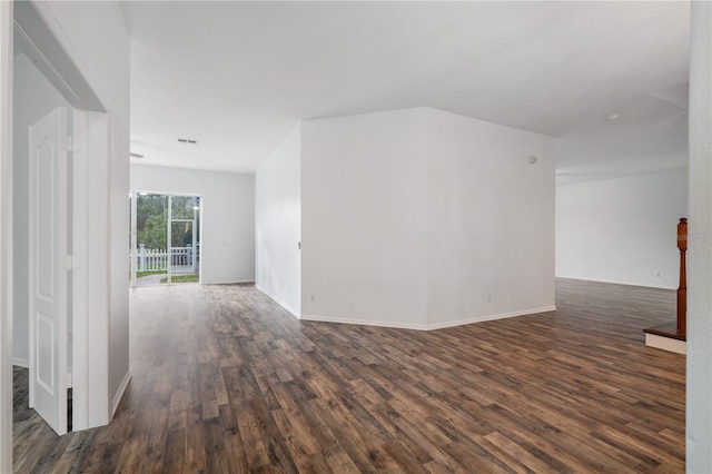 unfurnished room featuring dark hardwood / wood-style flooring