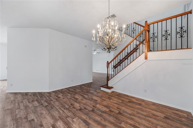 unfurnished living room with dark hardwood / wood-style floors