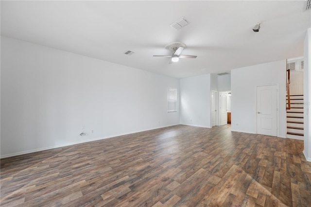 empty room featuring ceiling fan and dark hardwood / wood-style flooring