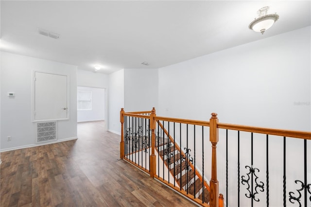 corridor with dark wood-type flooring