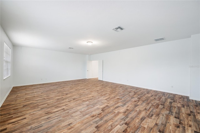 spare room with hardwood / wood-style flooring