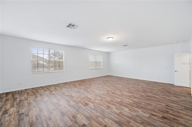 empty room with wood-type flooring