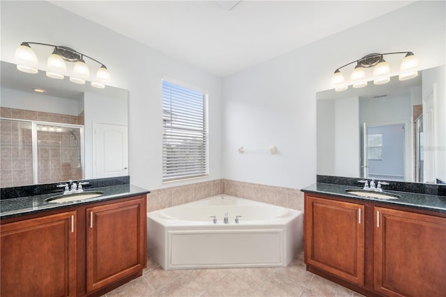 bathroom featuring vanity, tile patterned floors, and plus walk in shower