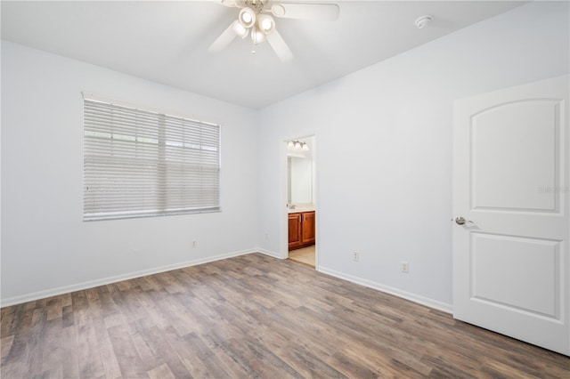 unfurnished room with ceiling fan and wood-type flooring