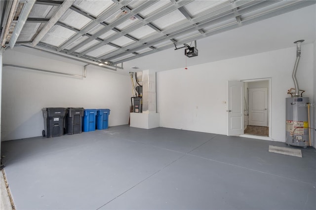 garage featuring a garage door opener and water heater