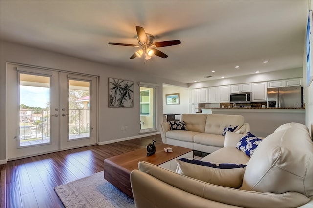 living room with french doors, hardwood / wood-style flooring, and ceiling fan