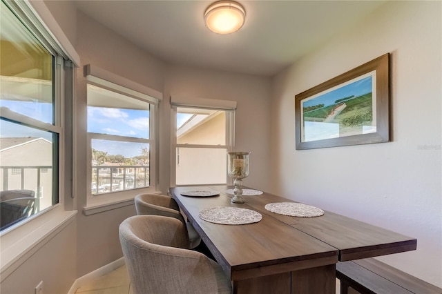 dining area featuring light tile patterned floors