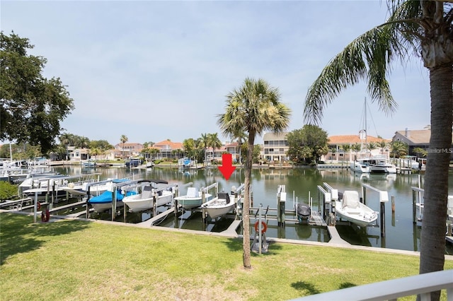 dock area featuring a yard and a water view