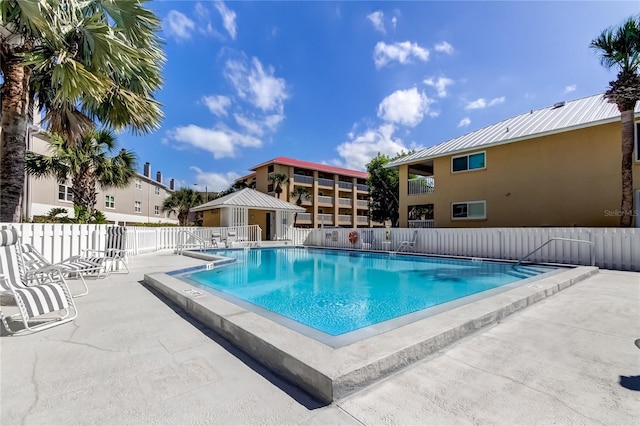 view of swimming pool featuring a patio area