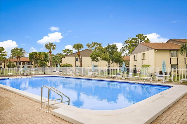 view of swimming pool with a patio area