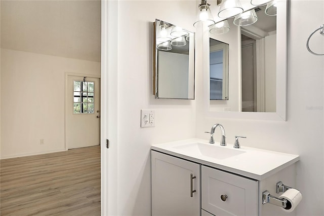 bathroom with vanity and wood-type flooring