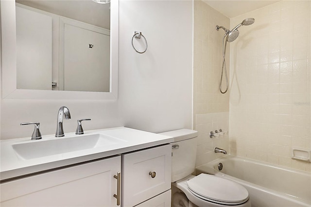 full bathroom featuring vanity, toilet, and tiled shower / bath