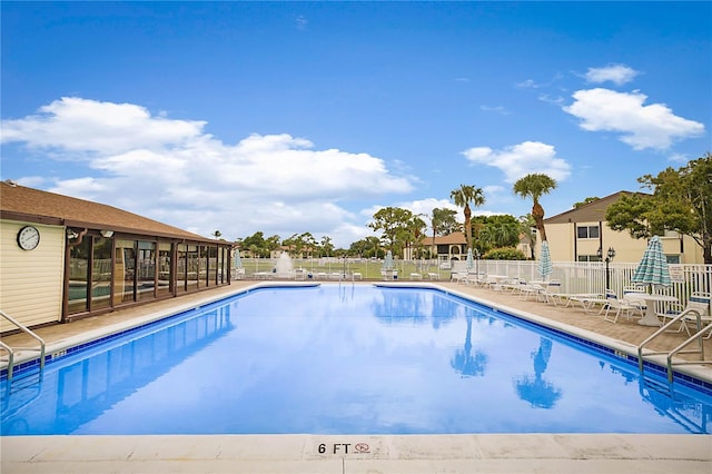 view of swimming pool with a patio area